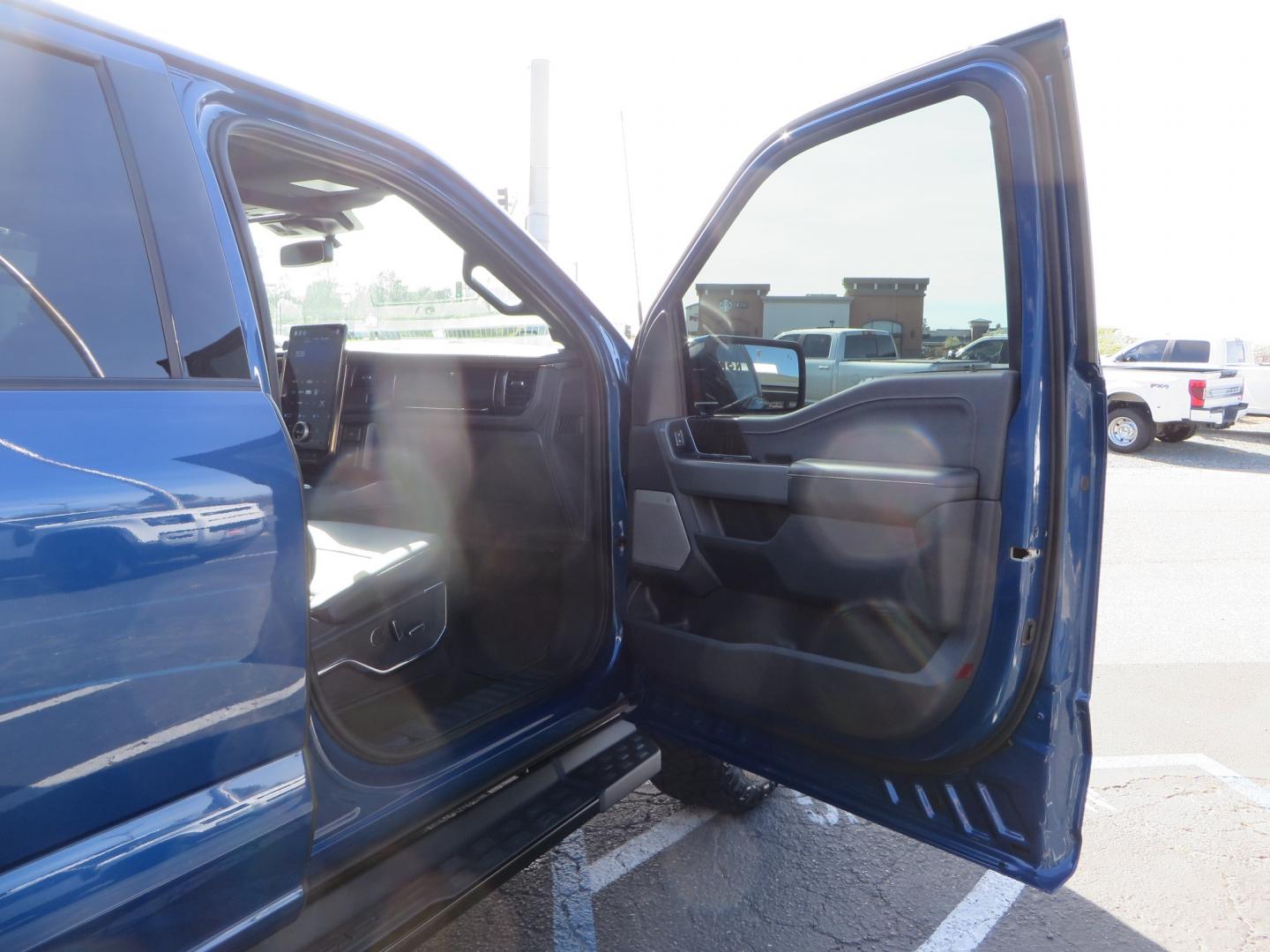 2022 BLUE /BLACK Ford F-150 Lariat Crew Cab 4WD (1FT6W1EV6NW) , located at 2630 Grass Valley Highway, Auburn, CA, 95603, (530) 508-5100, 38.937893, -121.095482 - Tired of gas prices and still want to look cool? Check out this Ford Lightning featuring a RC level kit, Nitto Ridge Grappler tires, Fuel Rebel wheels, Sinister front and rear bumpers, Baja Designs leds, Rigid Industries Leds, Bakflip F1, and window tint. - Photo#62